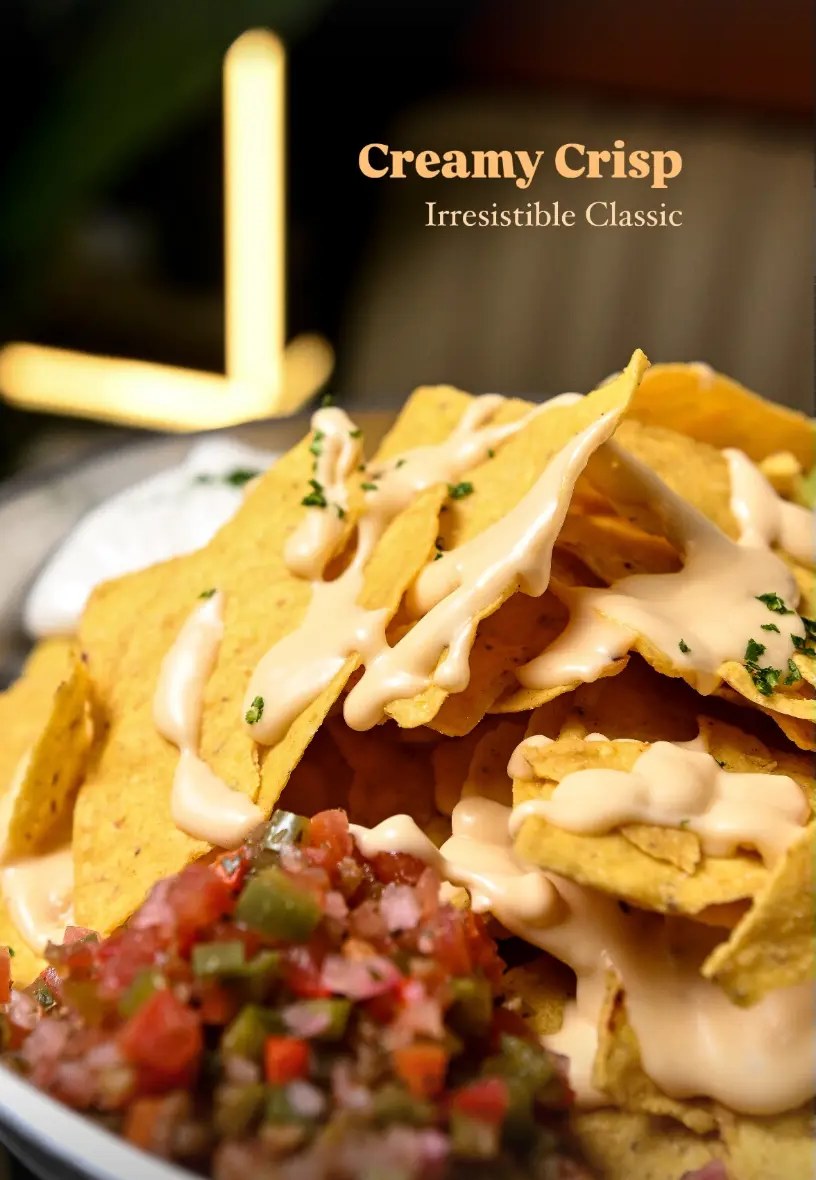 Nachos drizzled with warm cheese sauce